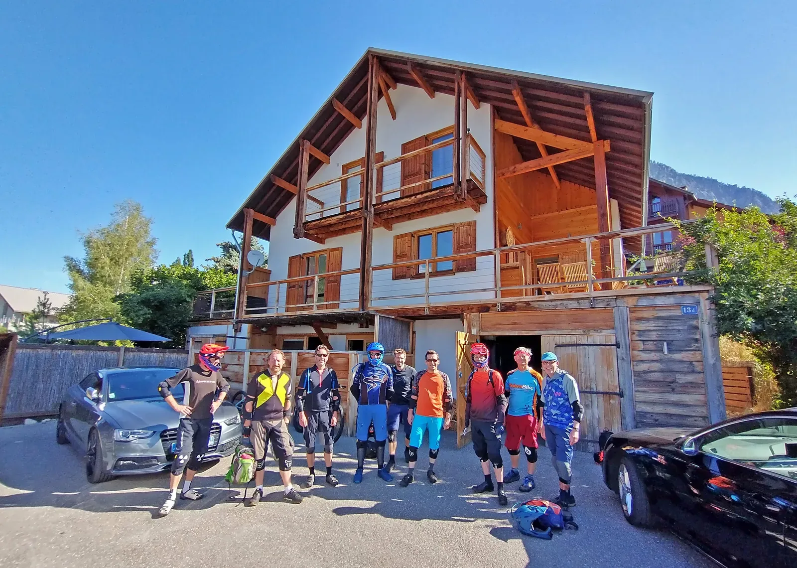 Bike-Alp riders gathered outside the chalet